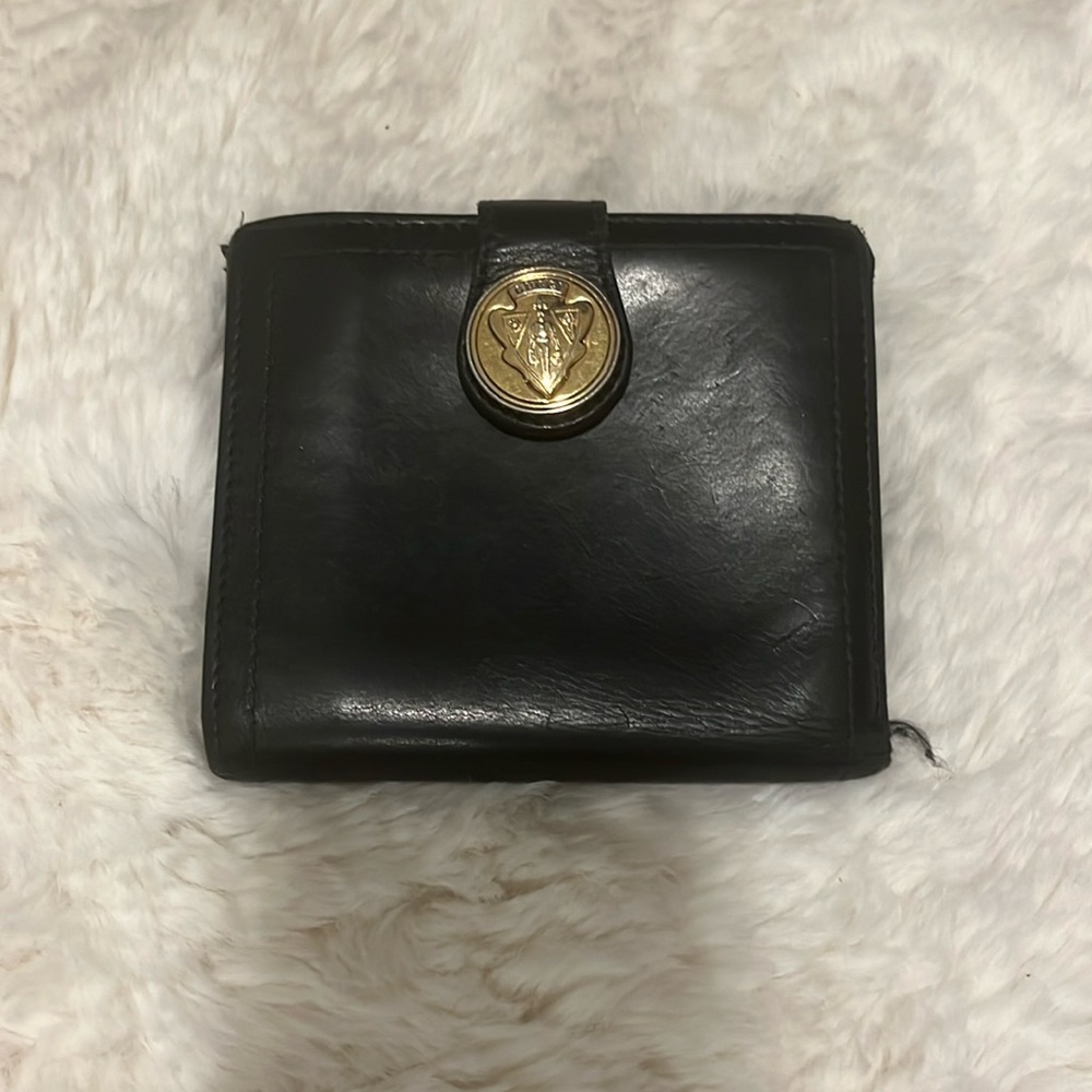 Authentic Vintage Black leather wallet with wear and tear.